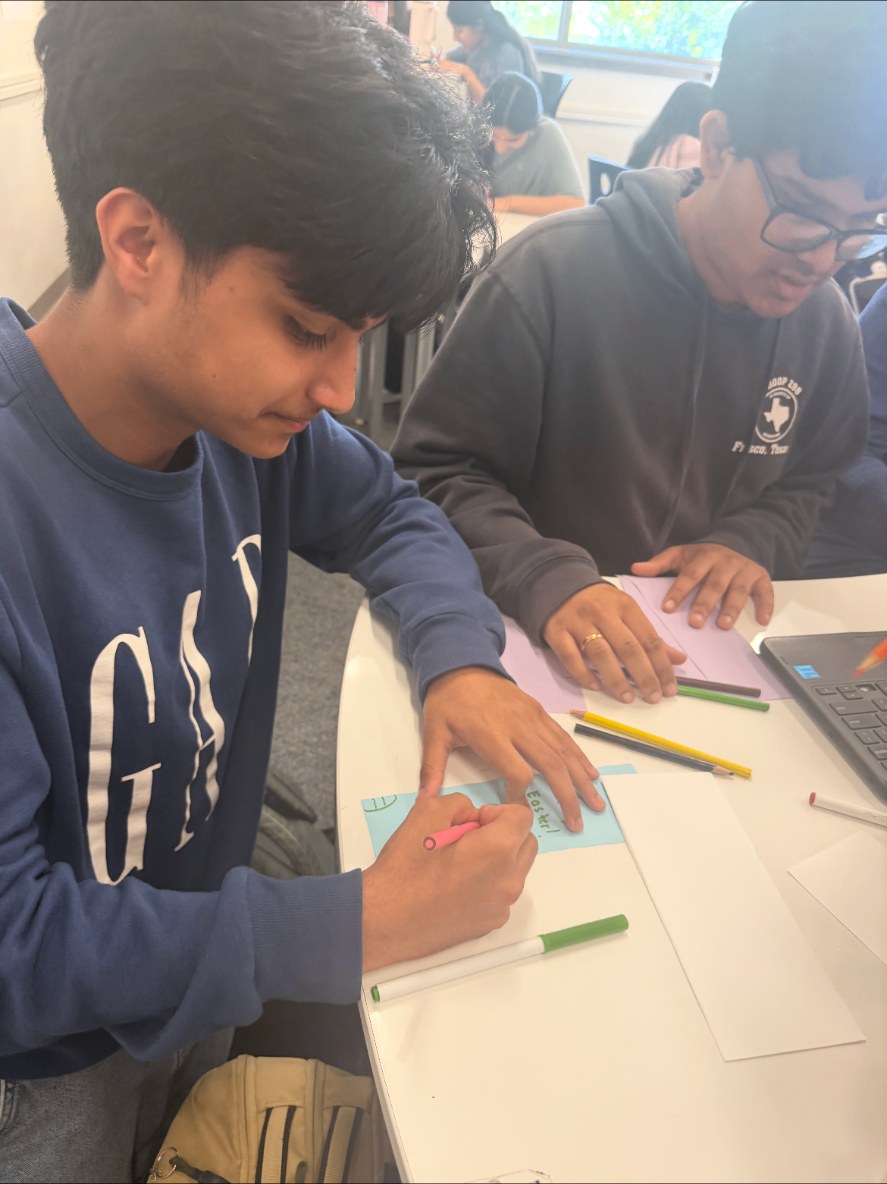 Student creating a handmade card