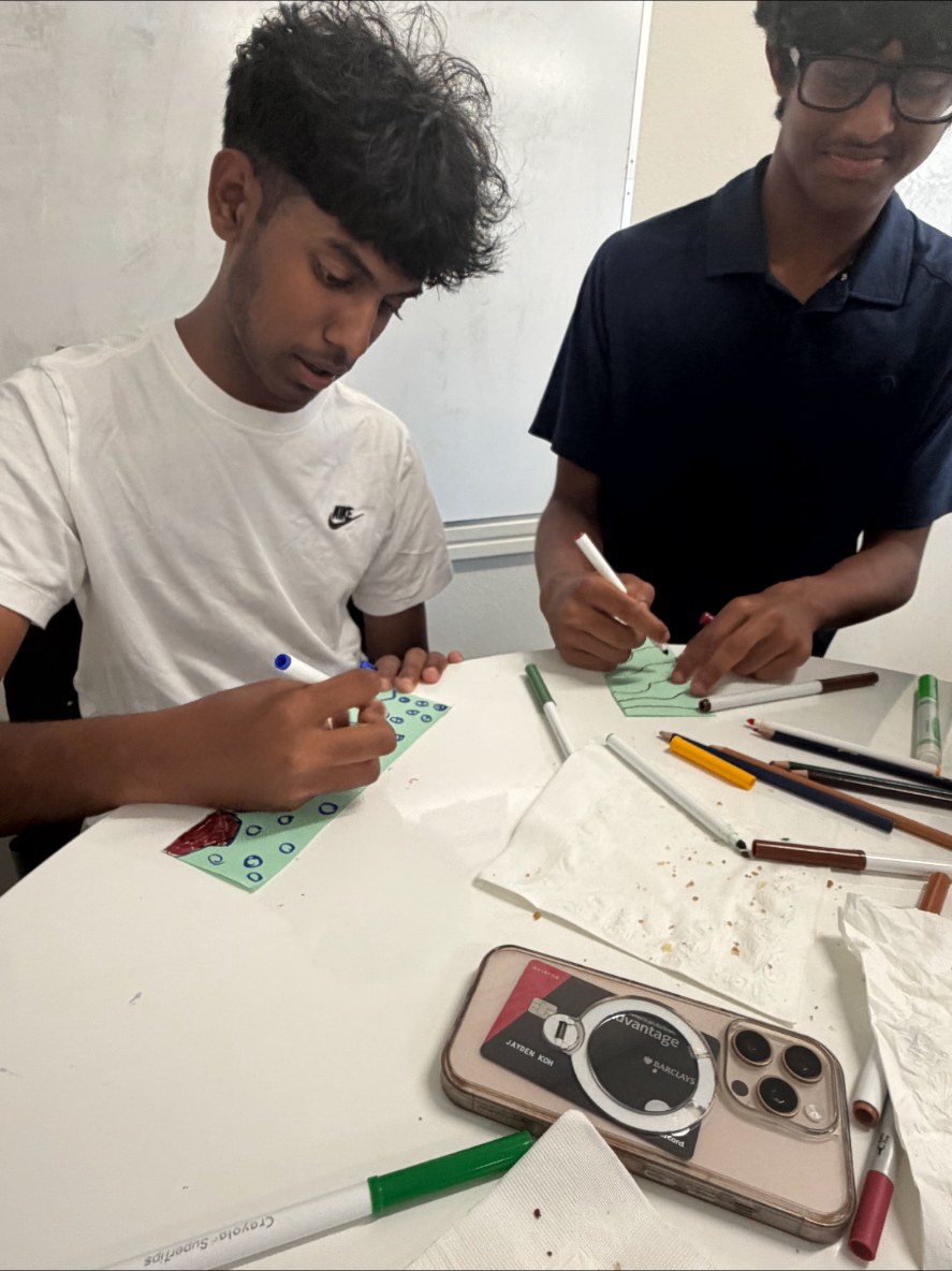 Students drawing cards for seniors